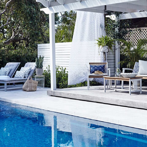 Cabana and sun chair near a Pool